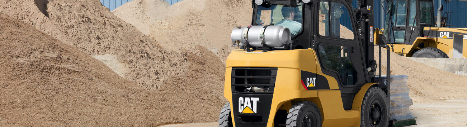 CAT Forklift Moving Materials Outdoors