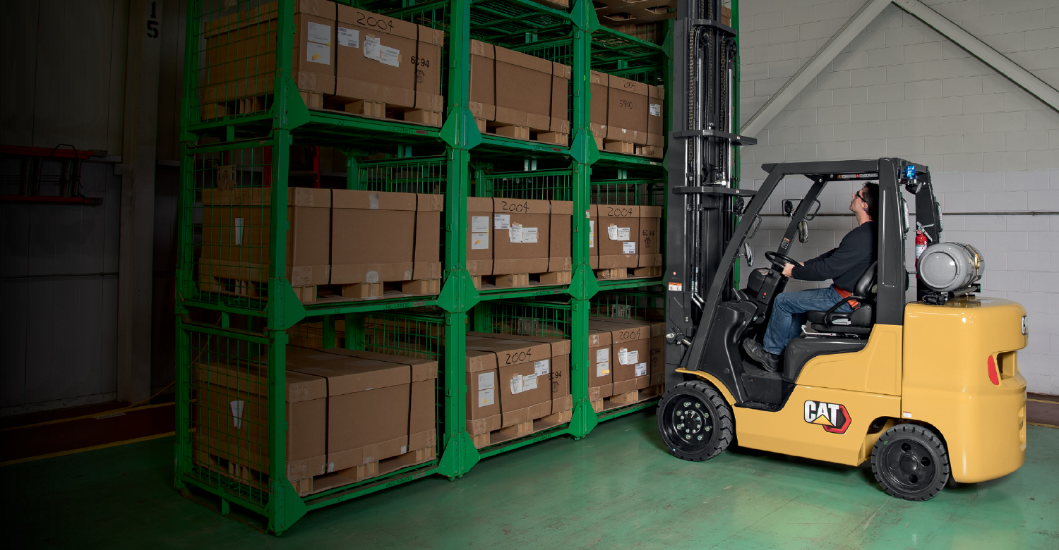 Cat forklift carrying cargo