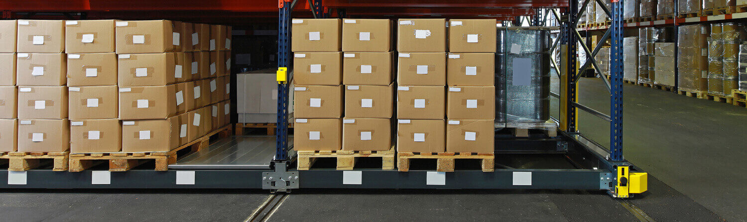 Boxes on Pallets to be moved by a Cat Electric Tow Truck