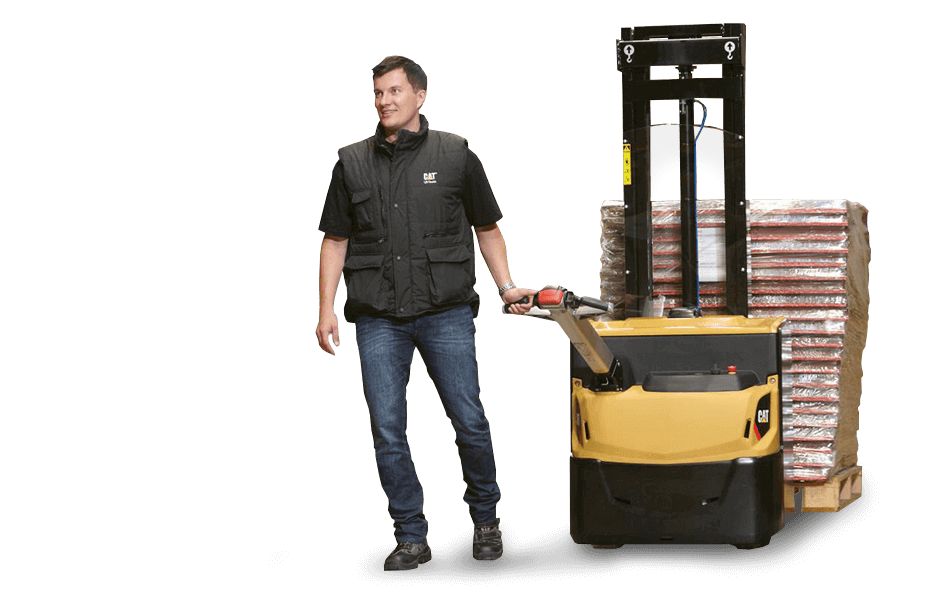 Worker pulling Cat pedestrian stacker with multiple pallets 