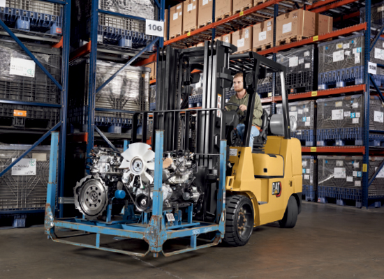 Cat GC35K IC forklift carrying an engine