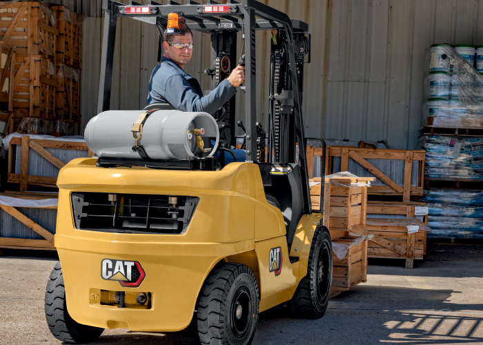 Cat GP15N fork trucks loading pallets outdoors