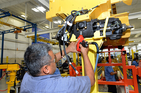 Technician Working on a Jungheinrich Forklift Part