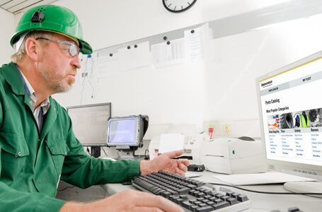 Man Looking at a Jungheinrich Parts Catalogue Online