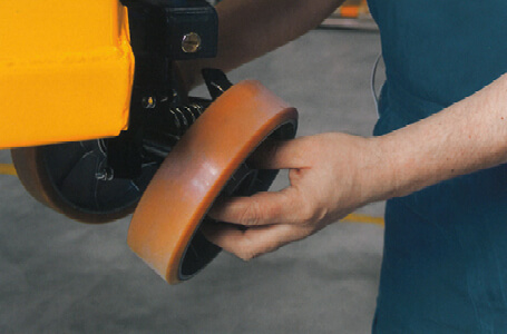 Technician Installing a Replacement Wheel onto a Jungheinrich Forklift