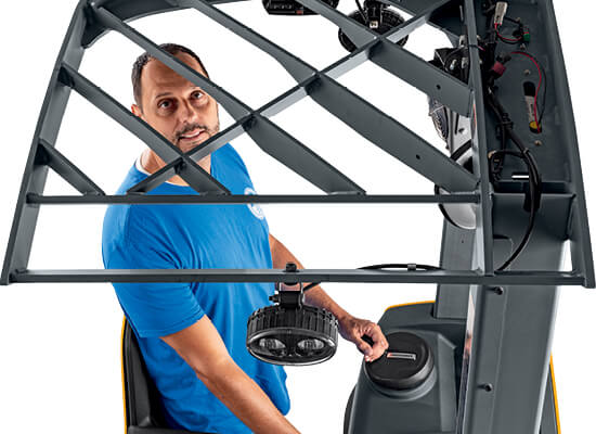 Worker looking up while operating Jungheinrich lift truck