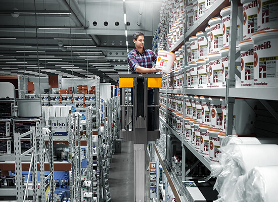 Worker Picking a Container off a Shelf from a EKM 202