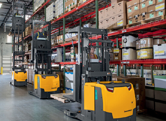 Three Jungheinrich High-Level Order Pickers in Use in a Warehouse