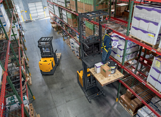 Overhead View of an Operator Using a Jungheinrich Order Picker to Retrieve Merchandise