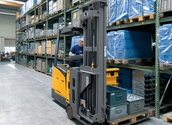 Worker moving materials using Jungheinrich man-down turret truck