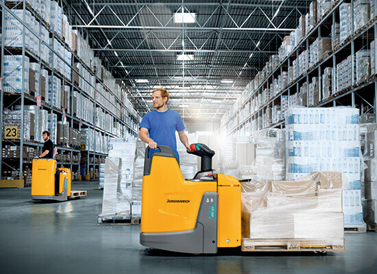 Operators Maneuvering Jungheinrich ERE Pallet Trucks in a Factory