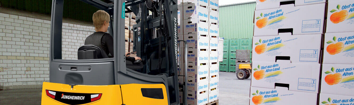 Jungheinrich forklift moving pallet of boxes