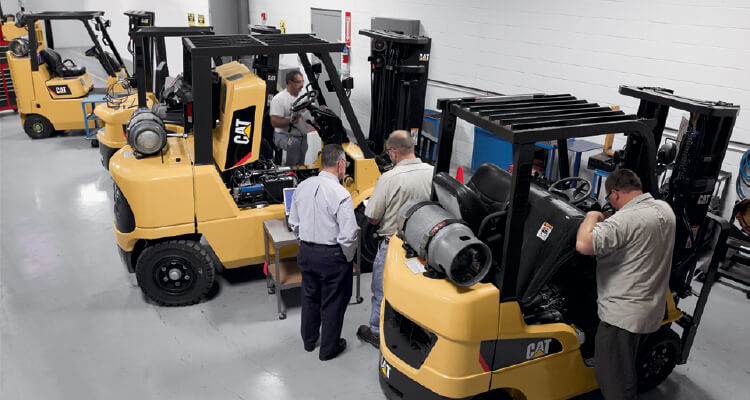 Cat forklifts being maintained