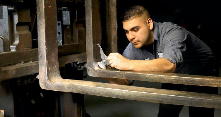 Close up inspection of forklift forks