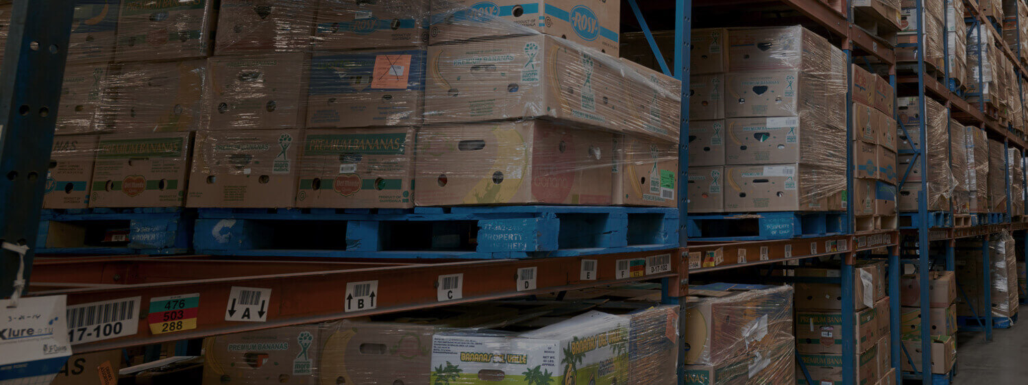 Boxes of Produce Stacked in a Warehouse
