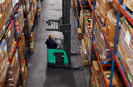 Operator looking up at forks on lift truck