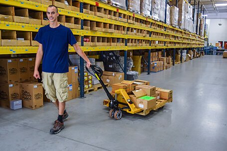 Hand lift truck being pulled