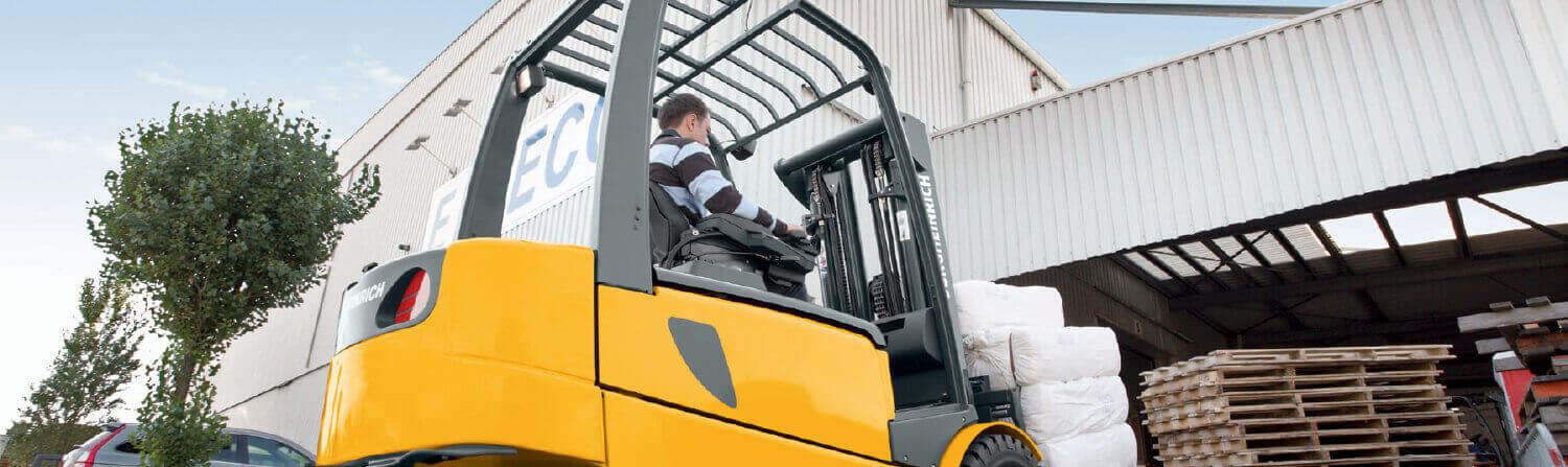 Jungheinrich forklift pulling into warehouse