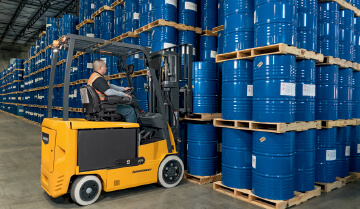 Operator Using a Jungheinrich Sit-Down Electric Counterbalanced Lift Truck in a Warehouse