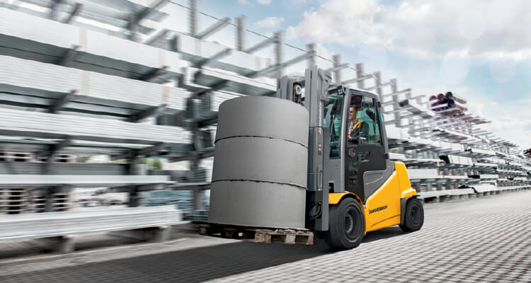 Jungheinrich Electric Forklift Hauling heavy cement cylinders 