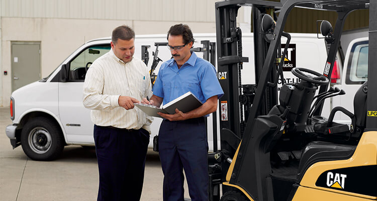 Man looking at contracts with forklift leasing agent